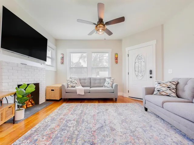a living room with furniture and a flat screen tv