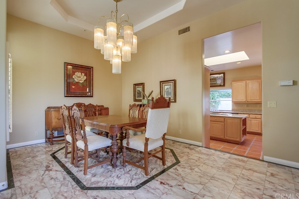 3036 Southwind Lane Vista, CA 92084 - Photo 14 of 45 a view of a dining room with furniture and chandelier