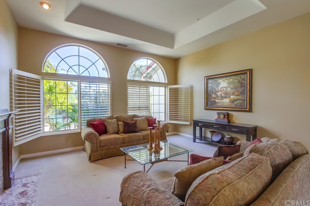 3036 Southwind Lane Vista, CA 92084 - Photo 16 of 45 a living room with furniture and a large window