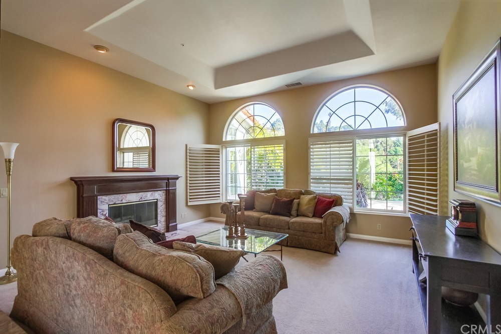 3036 Southwind Lane Vista, CA 92084 - Photo 17 of 45 a living room with furniture and a large window