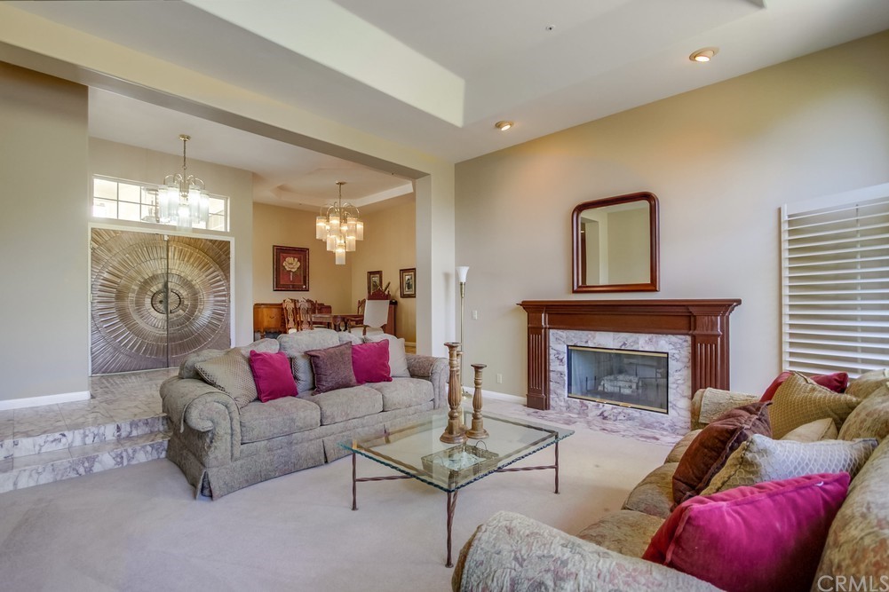 3036 Southwind Lane Vista, CA 92084 - Photo 18 of 45 a living room with furniture and a fireplace