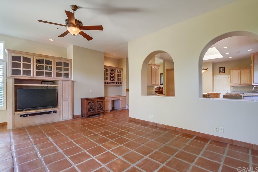 3036 Southwind Lane Vista, CA 92084 - Photo 23 of 45 an empty room with windows and fireplace