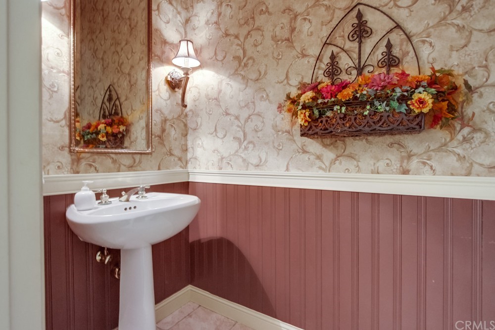 3036 Southwind Lane Vista, CA 92084 - Photo 25 of 45 a bathroom with a sink and a mirror