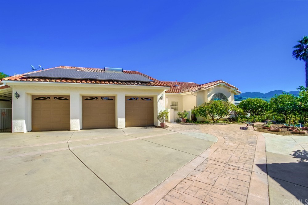 3036 Southwind Lane Vista, CA 92084 - Photo 4 of 45 a view of a house with a garage