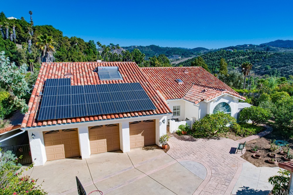 3036 Southwind Lane Vista, CA 92084 - Photo 5 of 45 a front view of a house with a yard