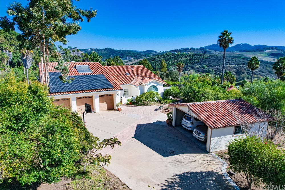 3036 Southwind Lane Vista, CA 92084 - Photo 6 of 45 a view of a patio with a table under an umbrella