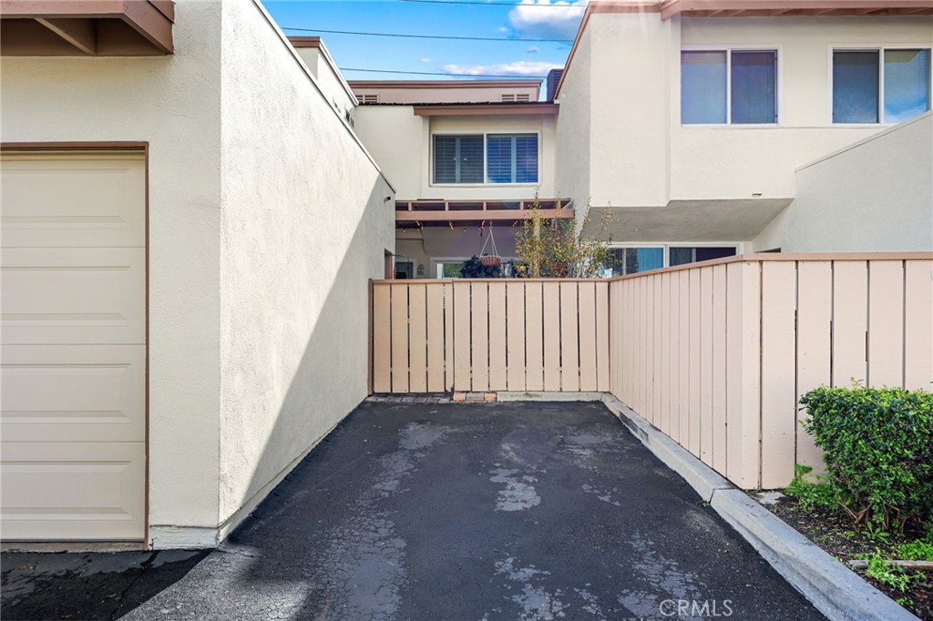 360 Meadow Court Brea, CA 92821 - Photo 24 of 41 Designated parking space next to garage with gate leading to patio