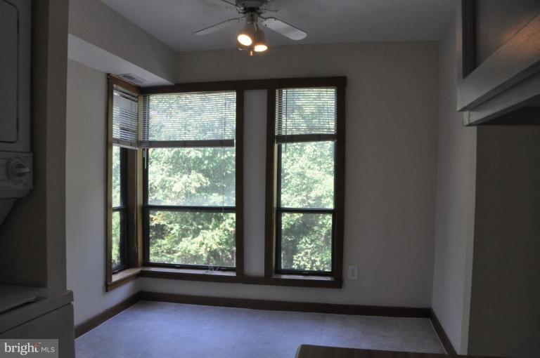 11240 Chestnut Grove Square, Unit 258 Reston, VA 20190 - Photo 5 of 19 a view of an empty room with a window
