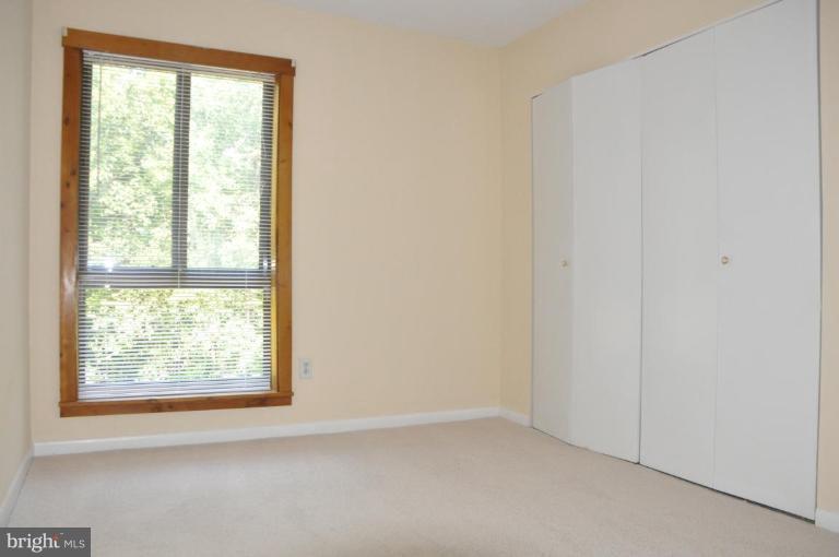 11240 Chestnut Grove Square, Unit 258 Reston, VA 20190 - Photo 10 of 19 an empty room with a window