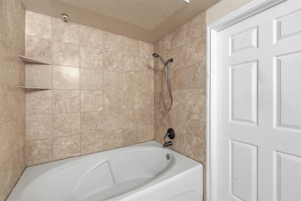 3102 Kings Road, Unit 2212 Dallas, TX 75219 - Photo 13 of 30 a bathroom with a bathtub