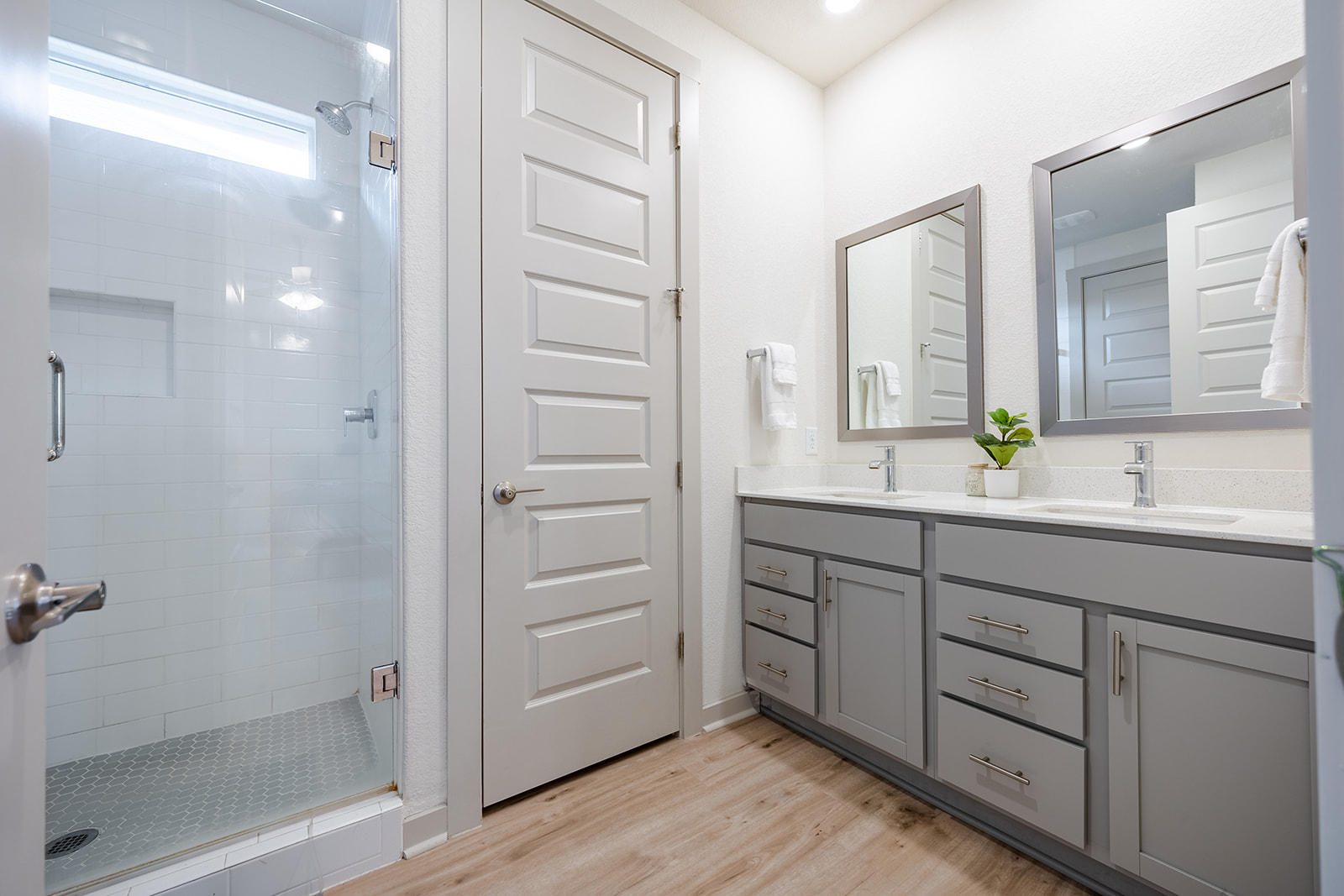 900 Balsora Cove Georgetown, TX 78628 - Photo 12 of 39 Dual vanity sinks complement the spacious walk-in shower in this contemporary bathroom.