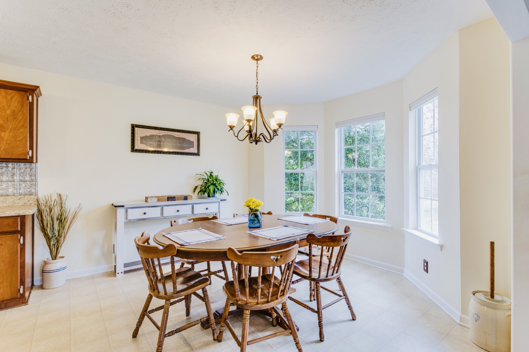 1482 Overton Court Rockvale, TN 37153 - Photo 12 of 58 a dining room with furniture a large window and a chandelier