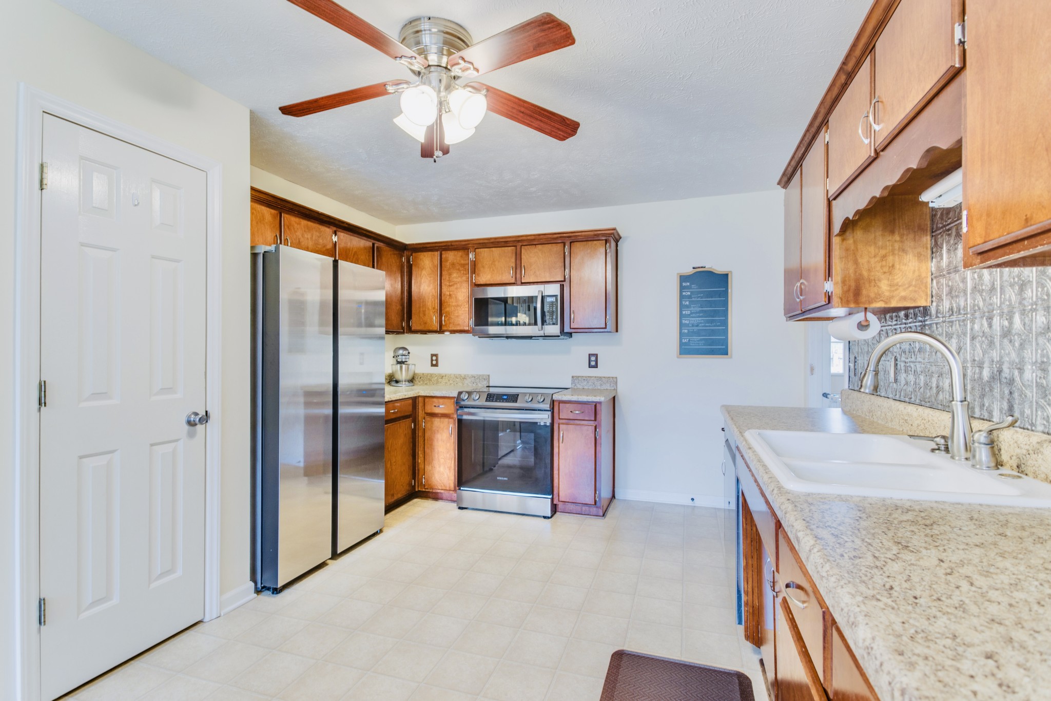 1482 Overton Court Rockvale, TN 37153 - Photo 16 of 58 a kitchen with stainless steel appliances granite countertop a sink stove and refrigerator