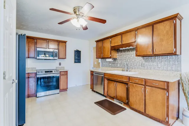 a kitchen with a sink and cabinets