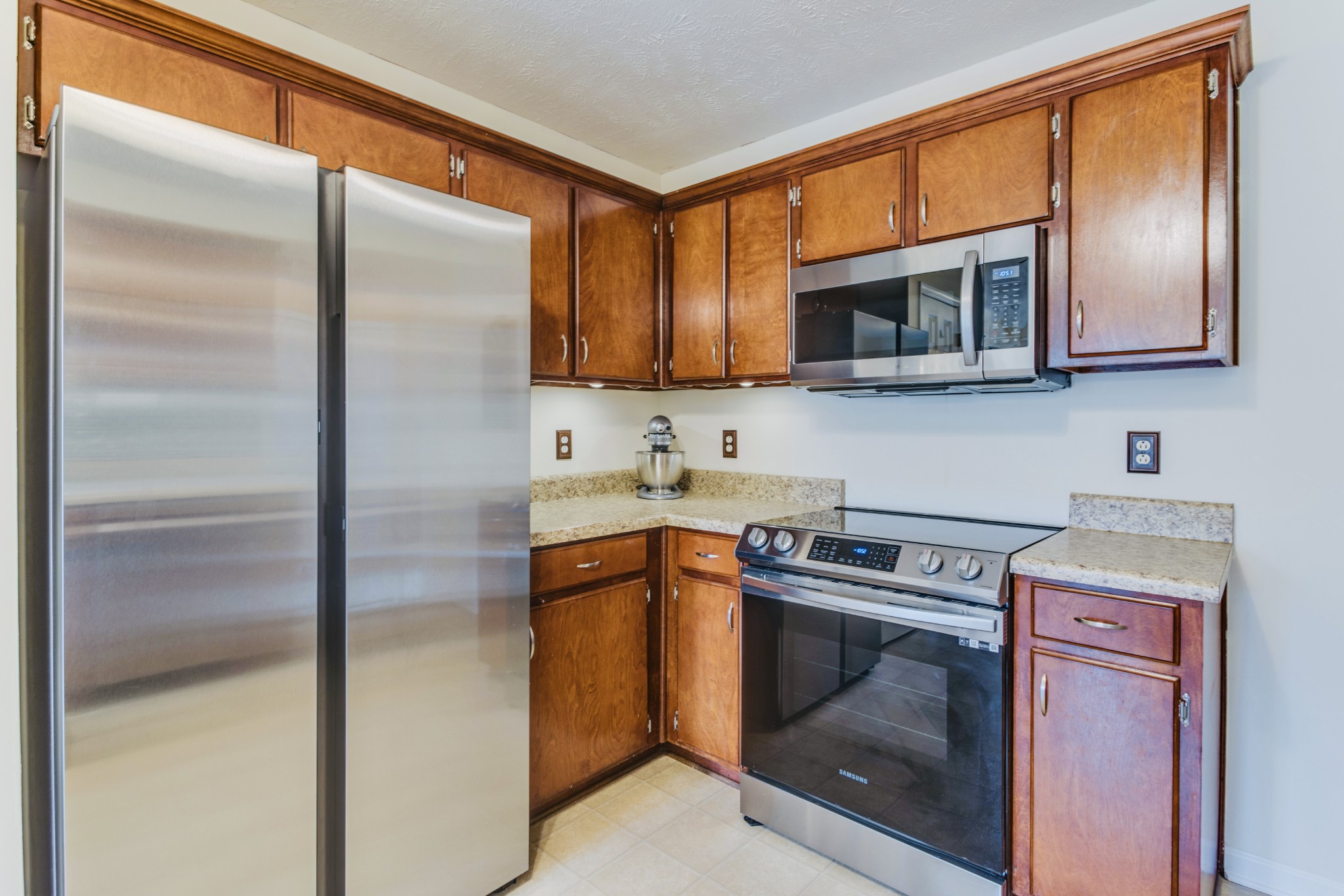 1482 Overton Court Rockvale, TN 37153 - Photo 19 of 58 a kitchen with stainless steel appliances granite countertop a refrigerator a stove a sink and a microwave