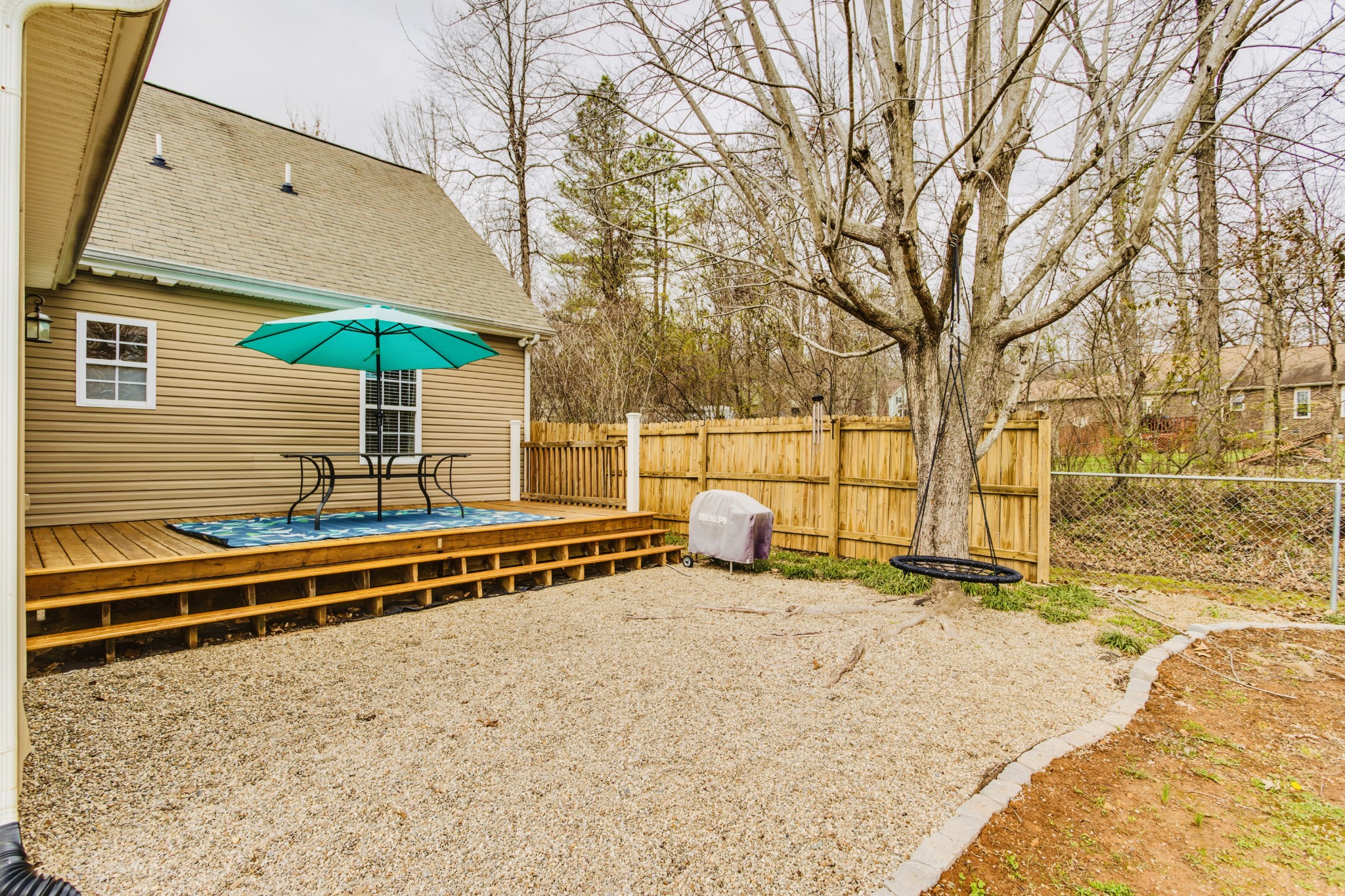 1482 Overton Court Rockvale, TN 37153 - Photo 46 of 58 a backyard of a house with basket ball table and chairs