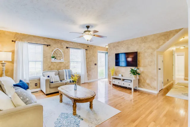 a living room with furniture and a flat screen tv