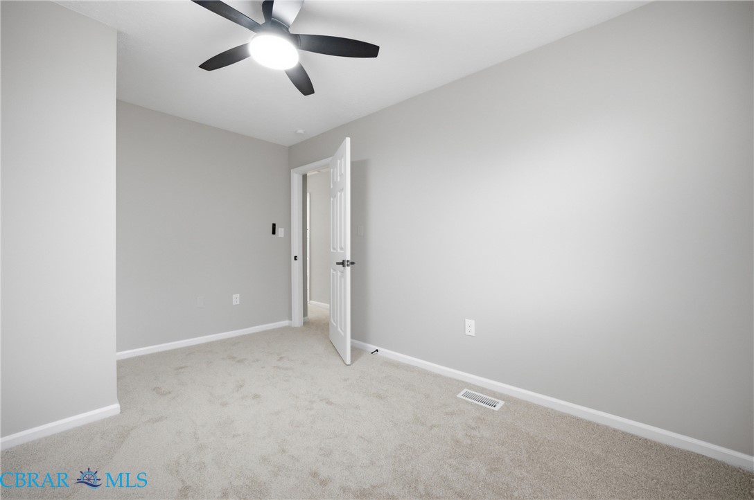 733 Spruce Street Hampton, VA 23661 - Photo 16 of 29 Spare room with light colored carpet and a ceiling fan