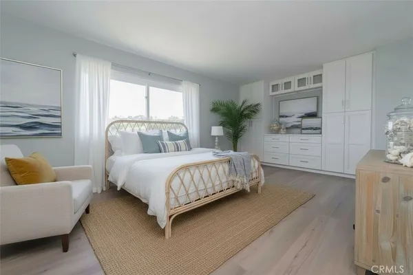 a bedroom with a bed and a couch