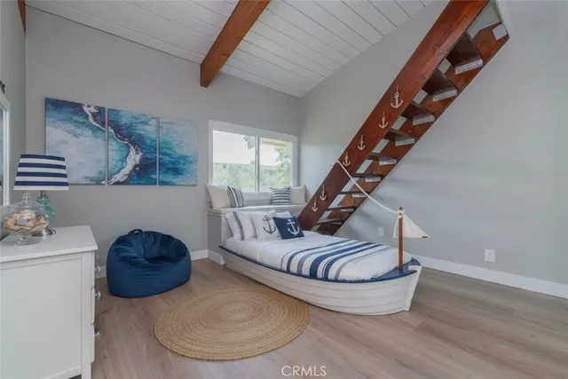 a living room with furniture and stairs