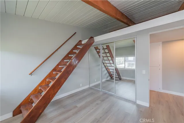 wooden floor with an entryway