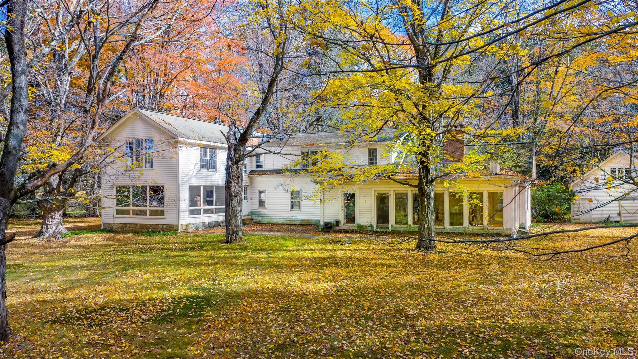 64 South Quaker Hill Road Pawling, NY 12564 - Photo 1 of 46 View of front facade with a patio area and a front yard