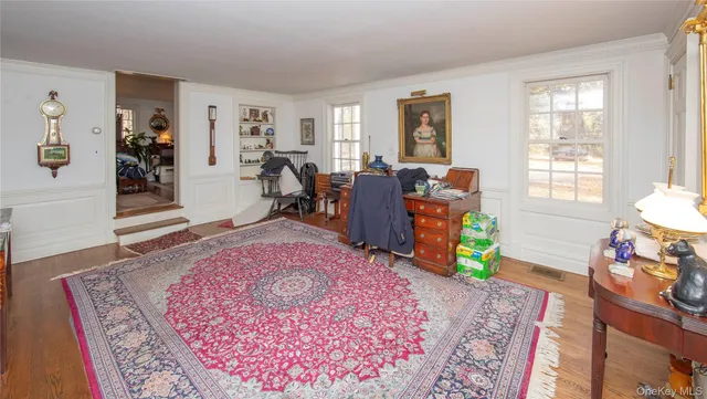 a view of a bedroom with closet and window
