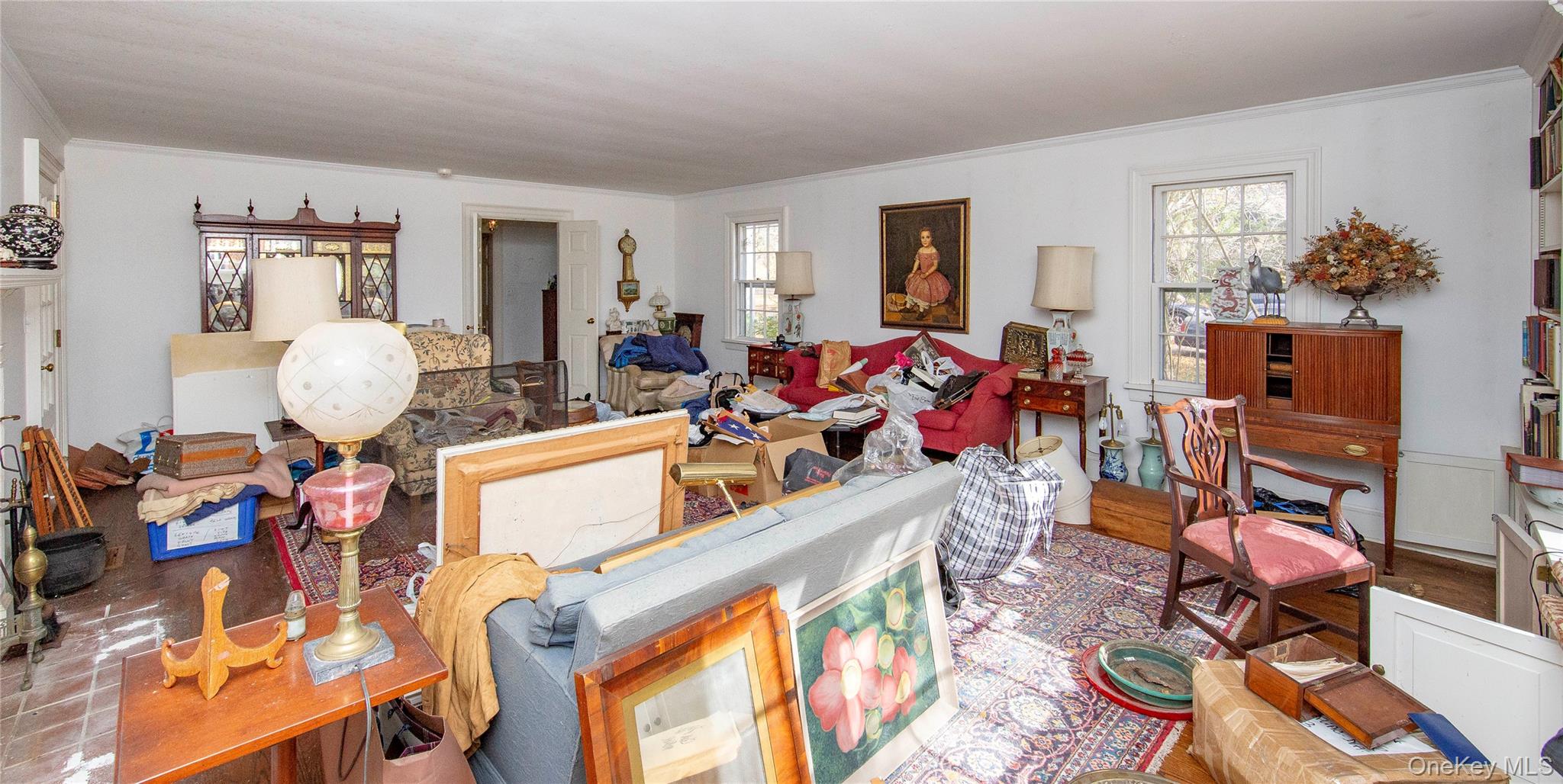 64 South Quaker Hill Road Pawling, NY 12564 - Photo 25 of 46 a living room with furniture a chandelier and a wooden floor