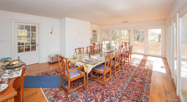 a living room with furniture a fireplace and a window