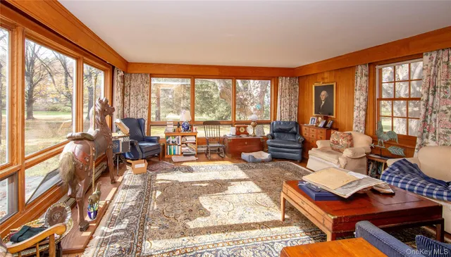 a view of a hallway with wooden floor and entryway