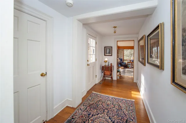 a view of a livingroom with furniture and floor to ceiling windows