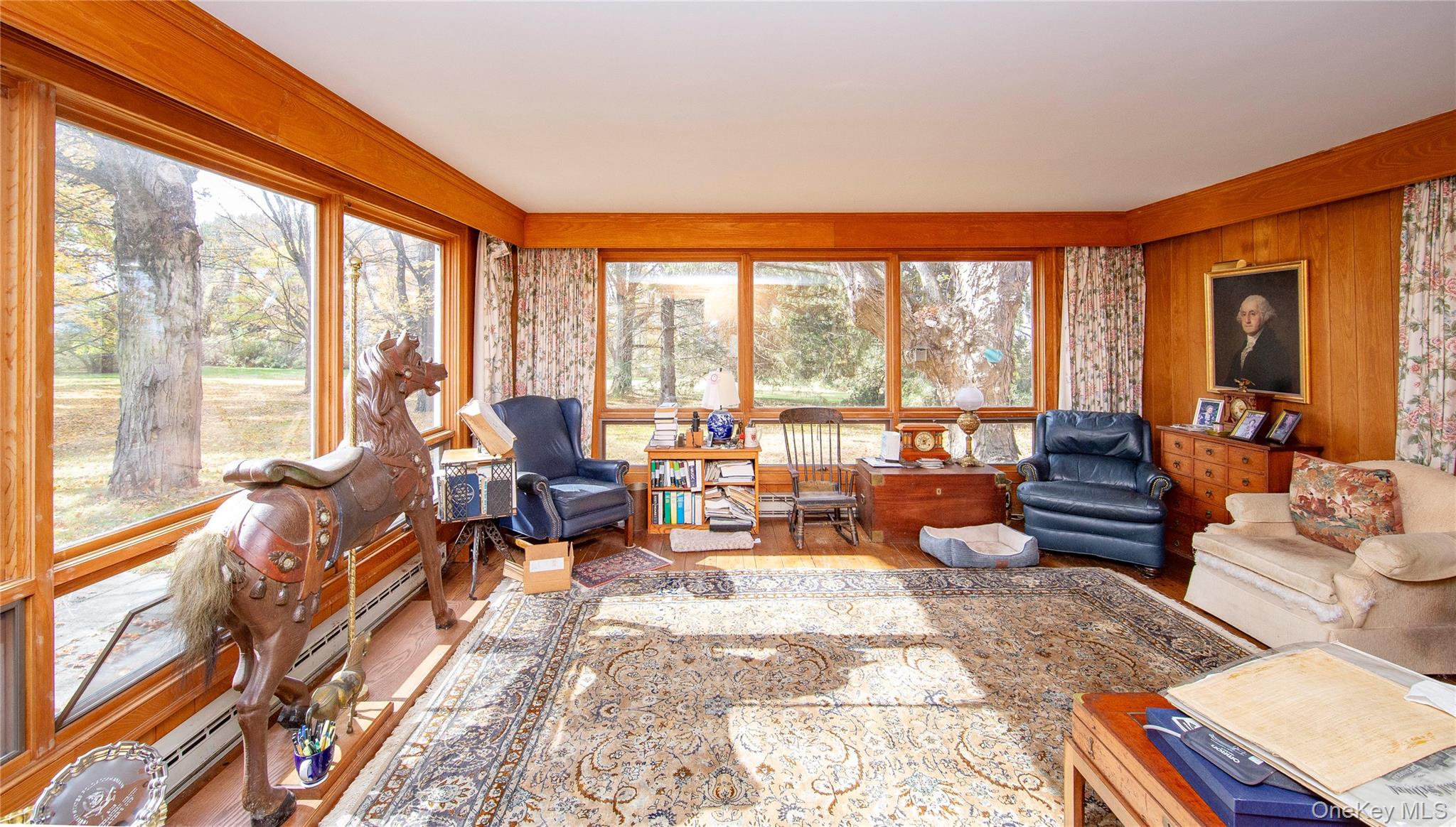 64 South Quaker Hill Road Pawling, NY 12564 - Photo 37 of 46 a living room with furniture and floor to ceiling windows