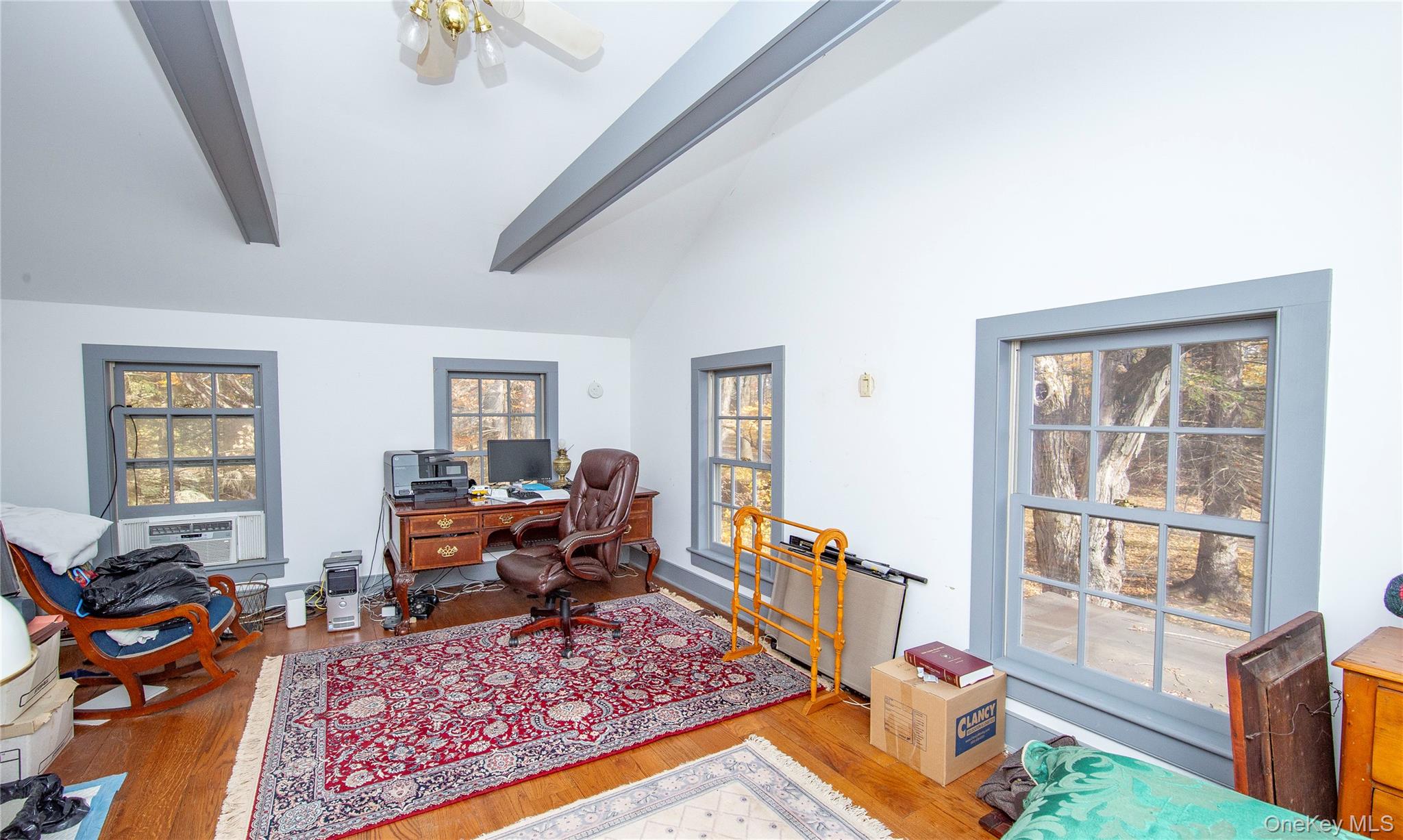 64 South Quaker Hill Road Pawling, NY 12564 - Photo 42 of 46 a living room with furniture windows and a flat screen tv