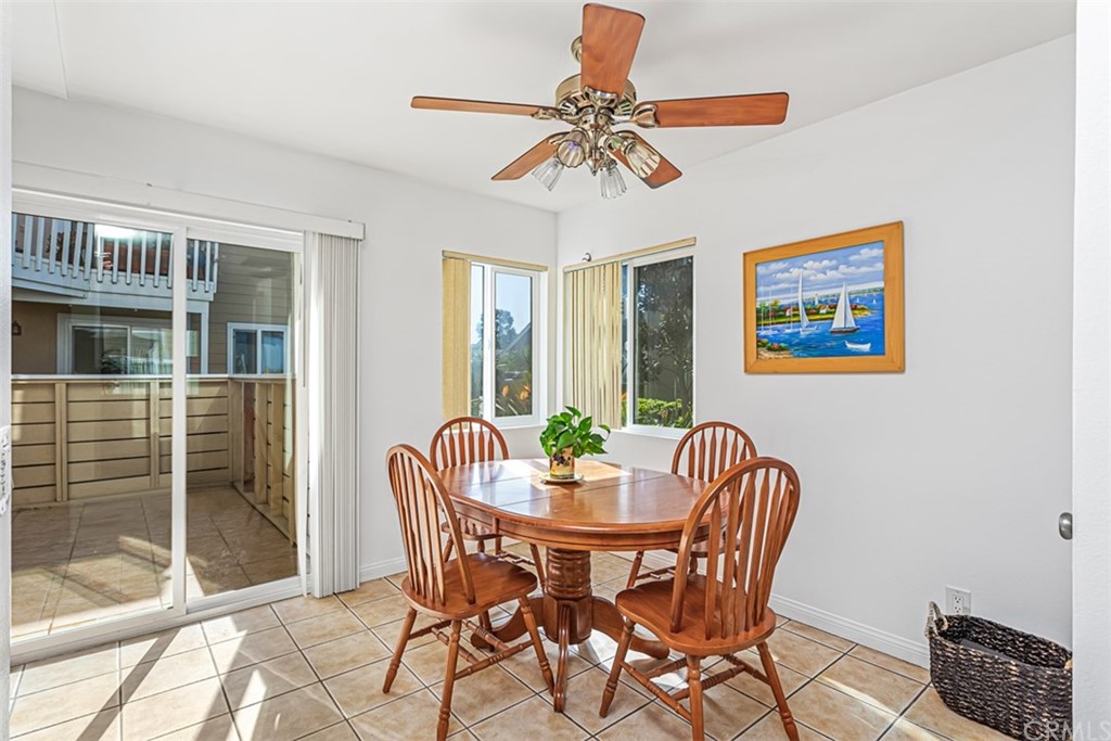 34006 Selva Road, Unit 392 Dana Point, CA 92629 - Photo 12 of 38 Same kitchen dining area with previous furniture displayed