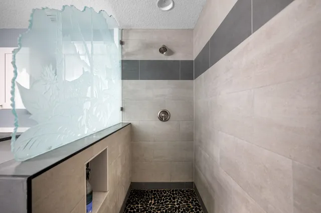 a bathroom with a sink and a shower