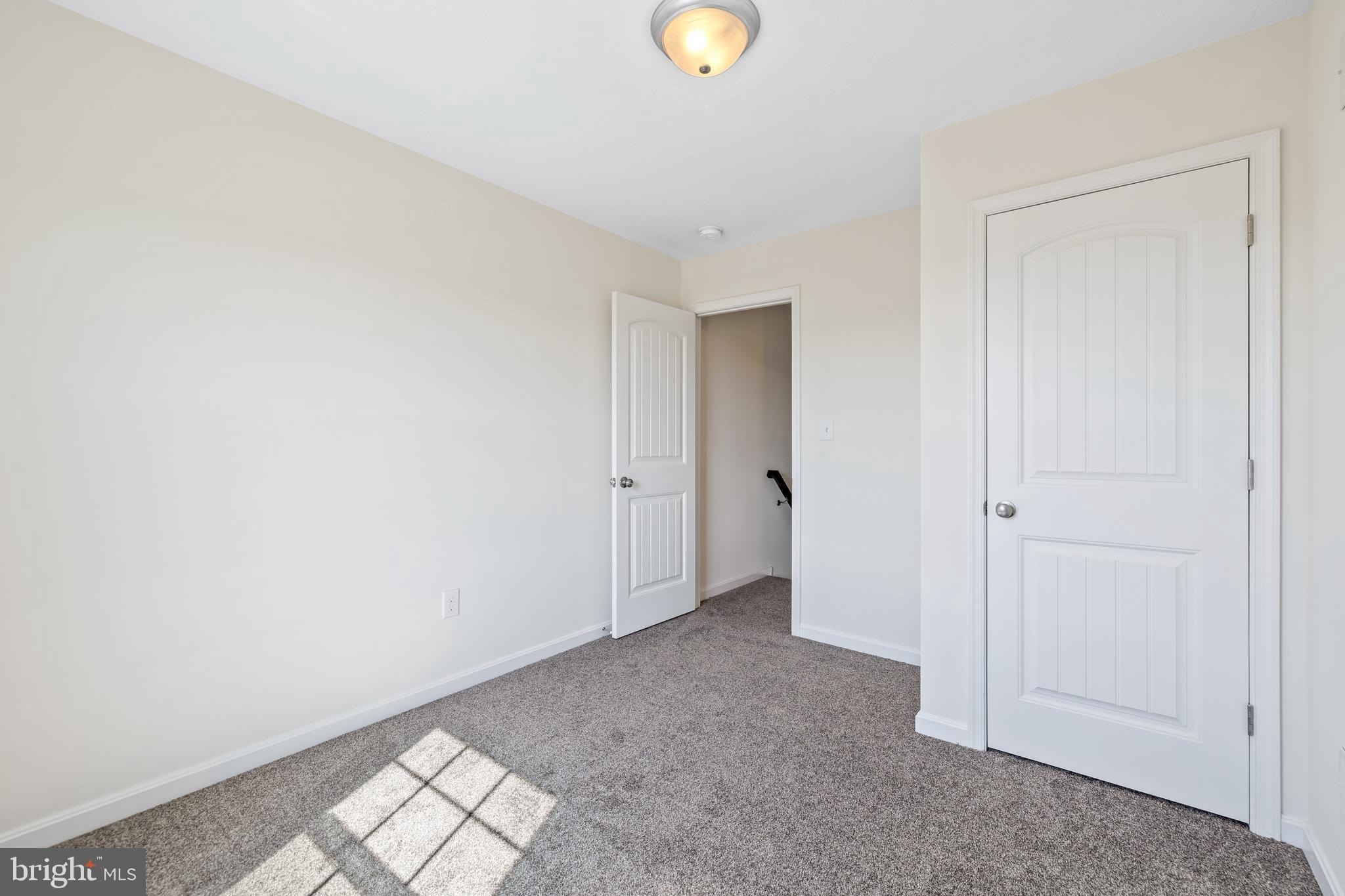 0 H Street, Unit 108 Carlisle, PA 17013 - Photo 15 of 26 a view of livingroom with an empty space and windows