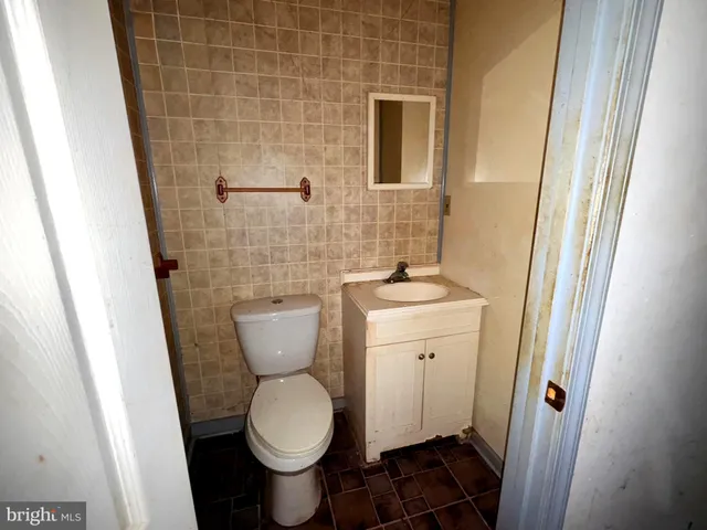 a bathroom with a toilet and a sink