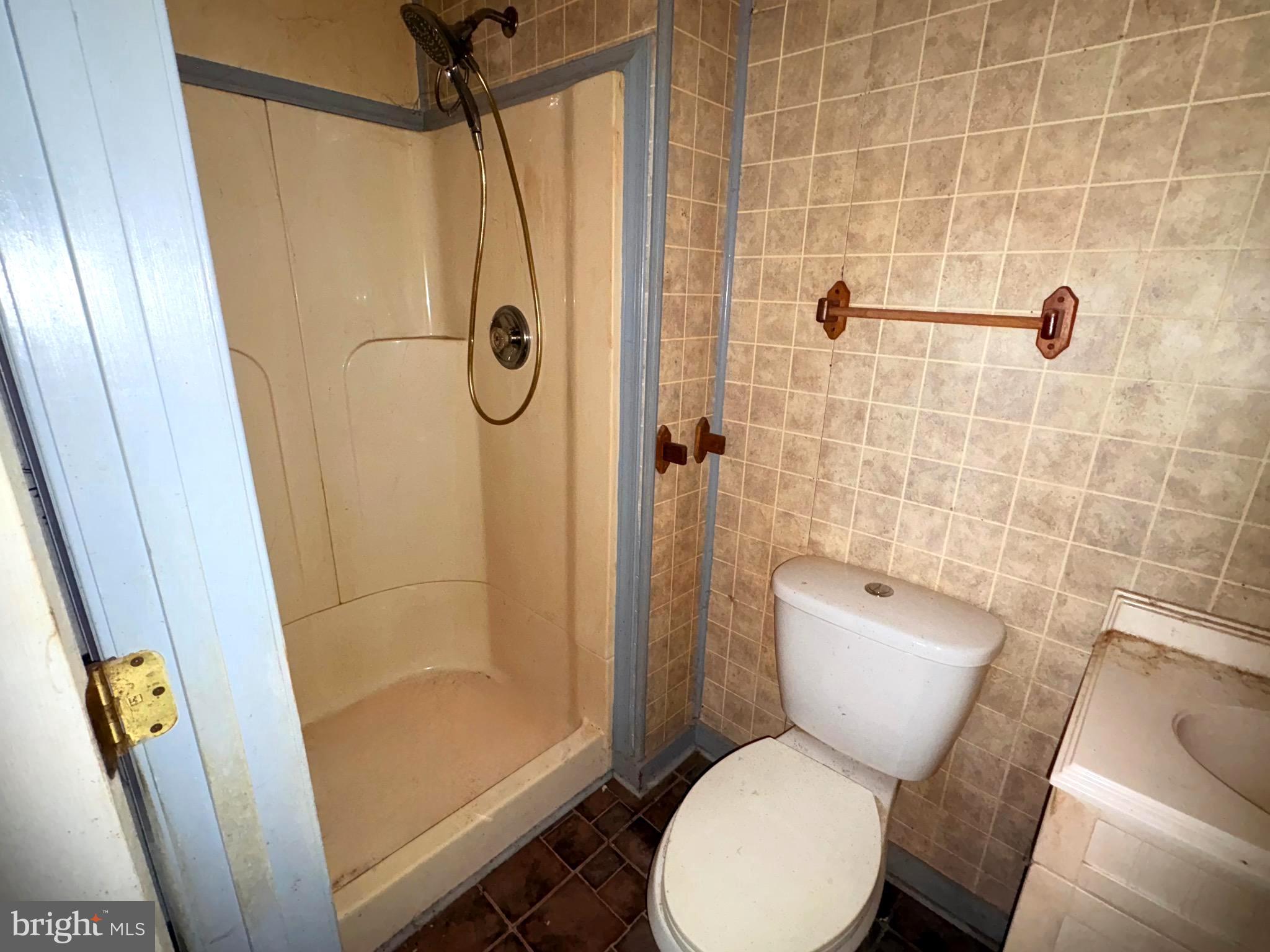 2145 Farm Creek Road Wingate, MD 21675 - Photo 12 of 24 a bathroom with a toilet and shower