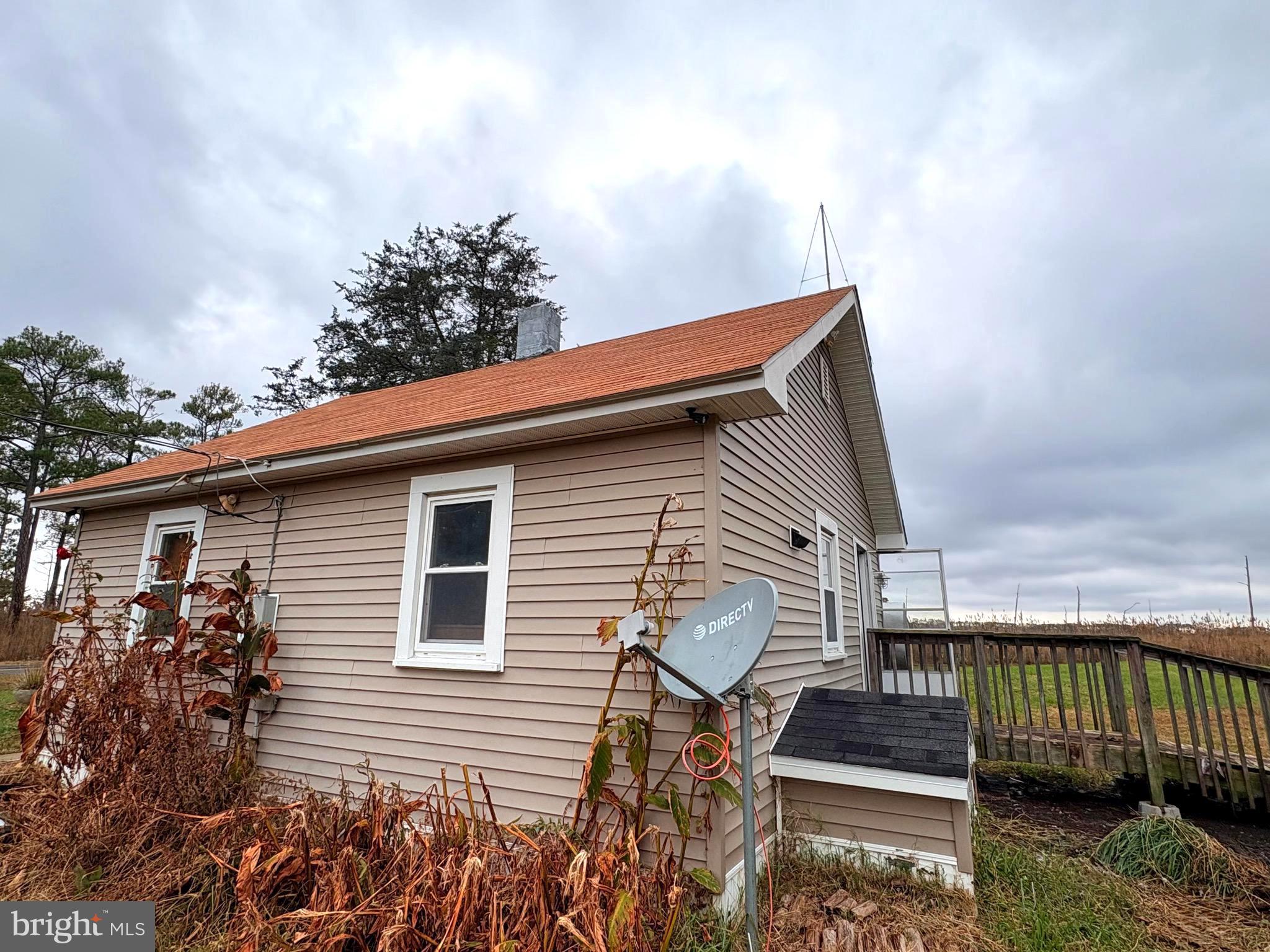 2145 Farm Creek Road Wingate, MD 21675 - Photo 14 of 24 a front view of a house with a yard