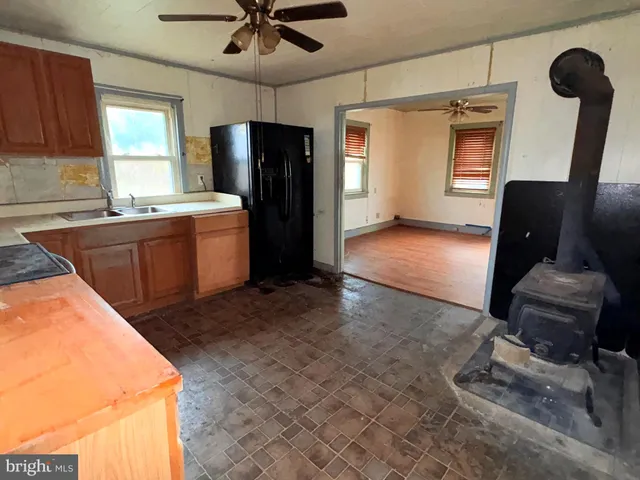a kitchen with refrigerator and window