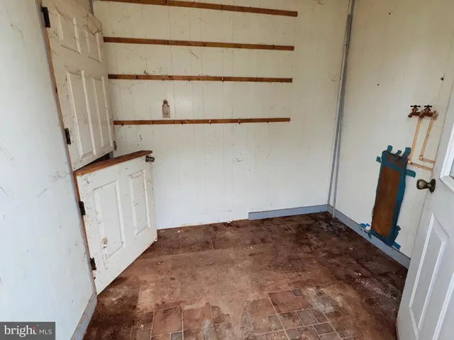 a view of a room with racks on the wall