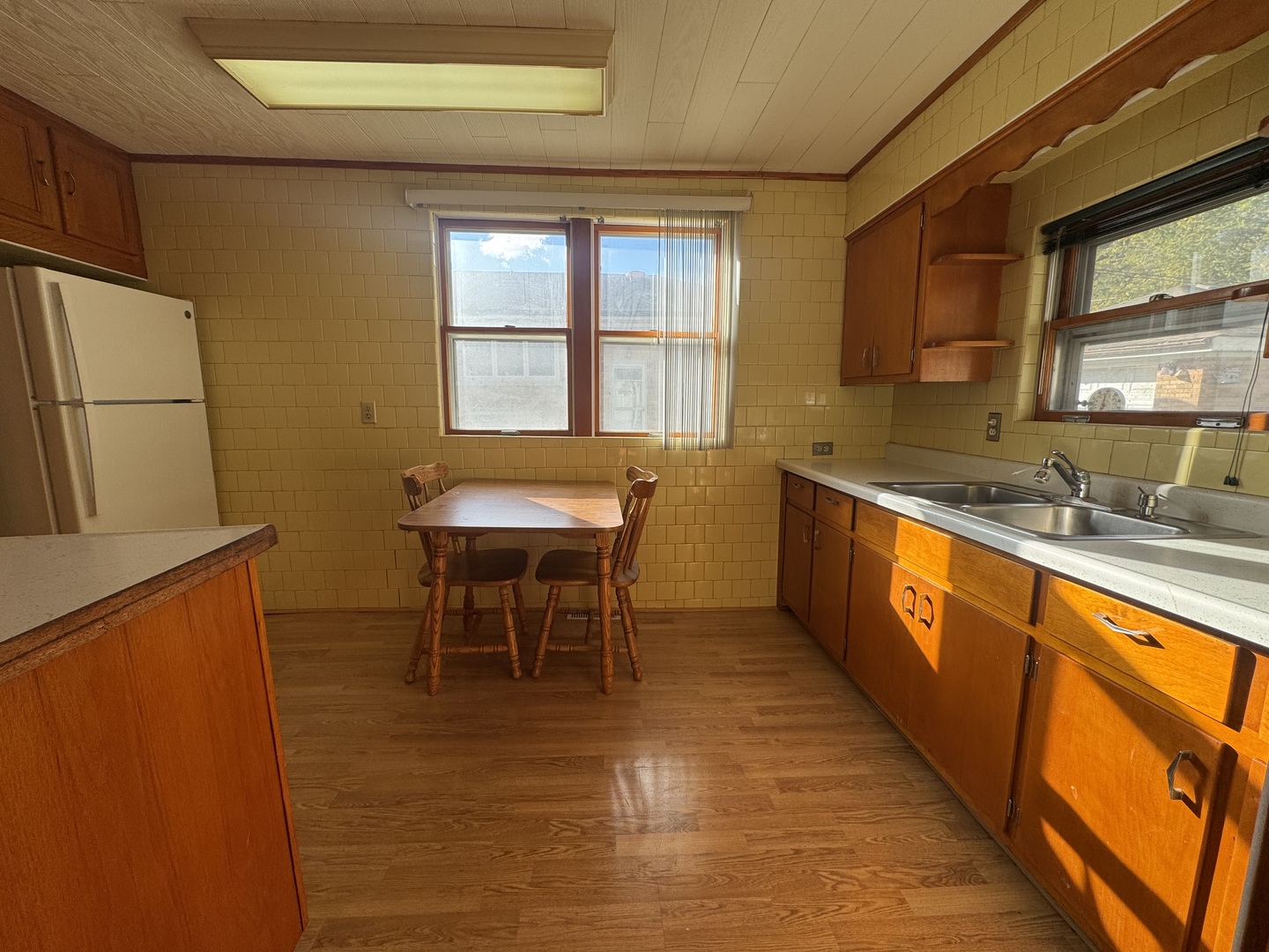 198 West Burlington Street Riverside, IL 60546 - Photo 13 of 19 a dining room with stainless steel appliances granite countertop furniture wooden floor and a window