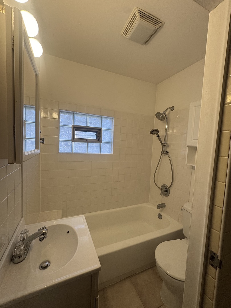 198 West Burlington Street Riverside, IL 60546 - Photo 8 of 19 a bathroom with a sink a toilet and bathtub