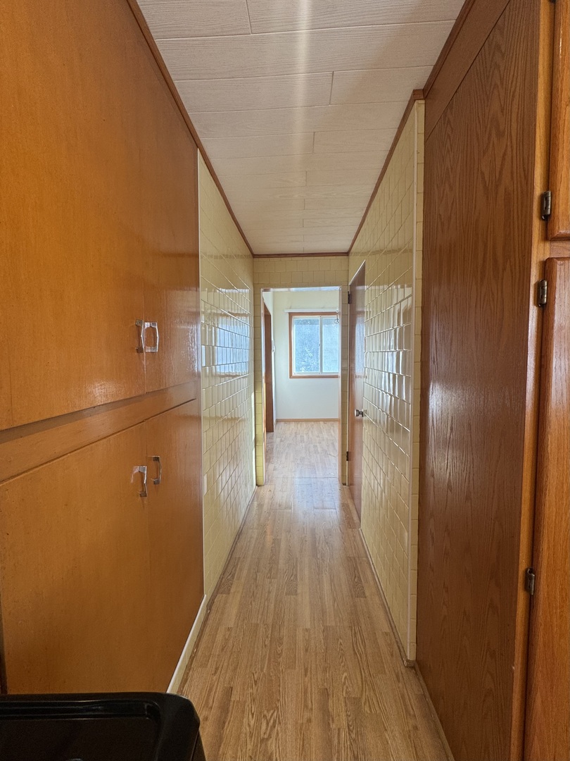 198 West Burlington Street Riverside, IL 60546 - Photo 9 of 19 a view of hallway with wooden floor