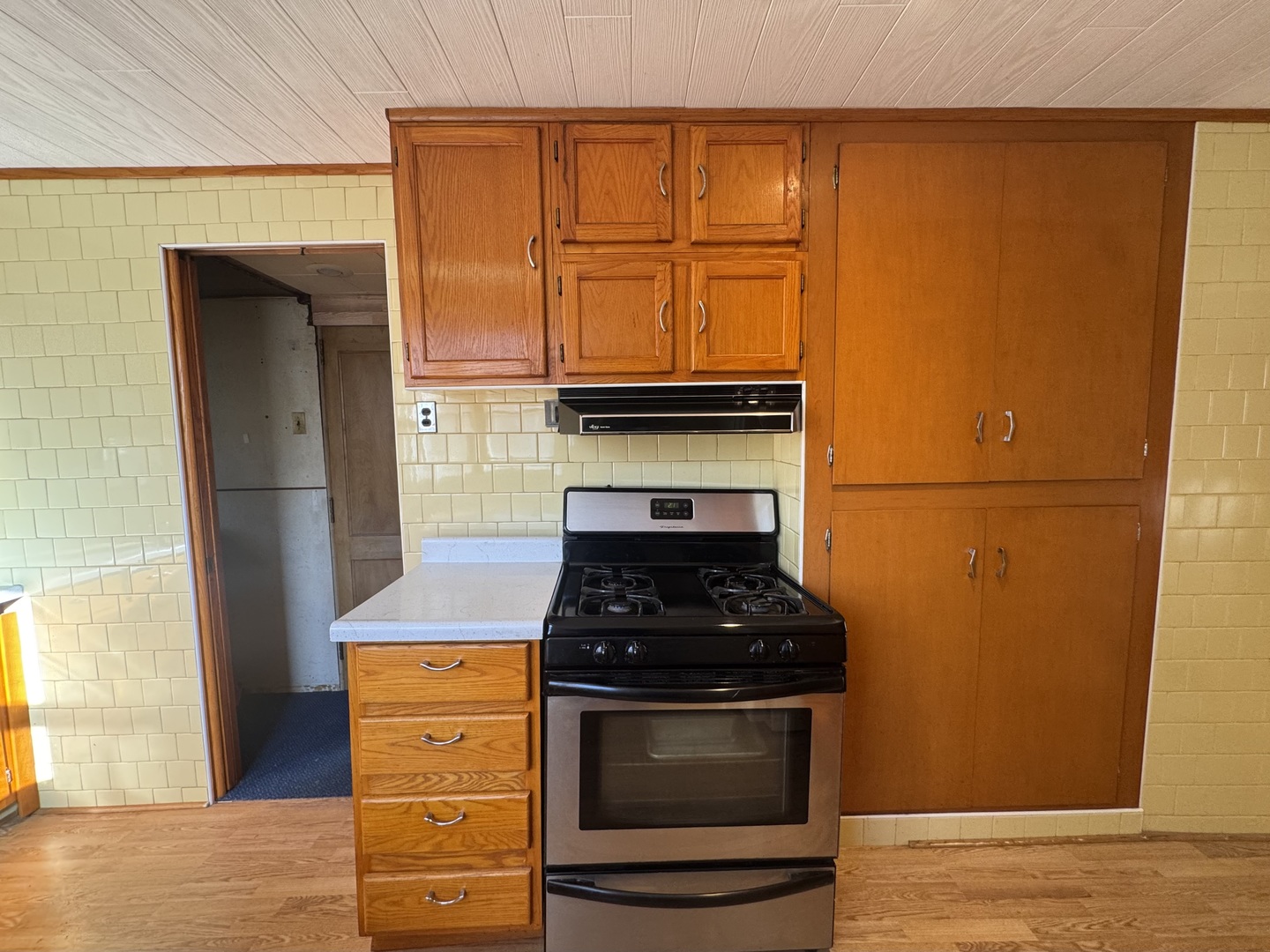 198 West Burlington Street Riverside, IL 60546 - Photo 10 of 19 a kitchen with stainless steel appliances granite countertop a stove and a refrigerator
