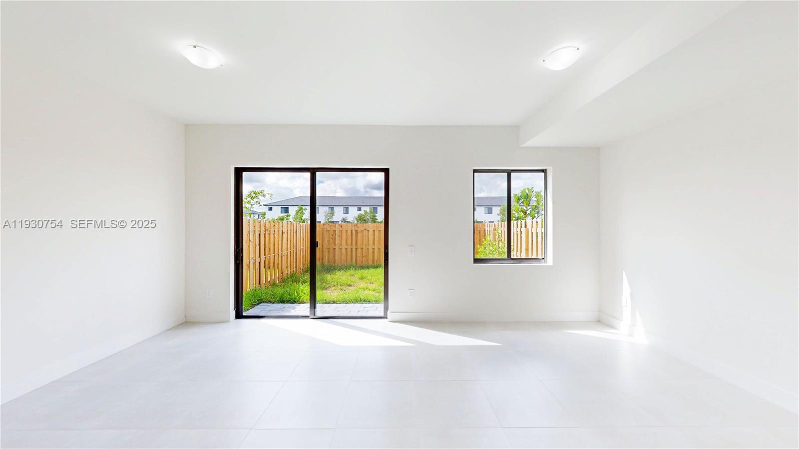 18936 Southwest 344th Terrace Homestead, FL 33034 - Photo 11 of 83 wooden floor in an empty room with a window