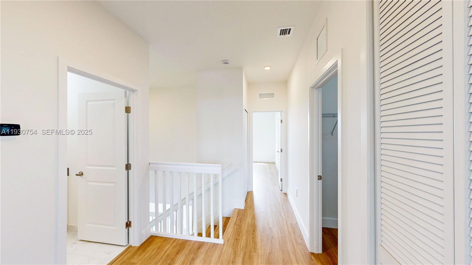18936 Southwest 344th Terrace Homestead, FL 33034 - Photo 24 of 83 a view of a hallway with wooden floor and staircase