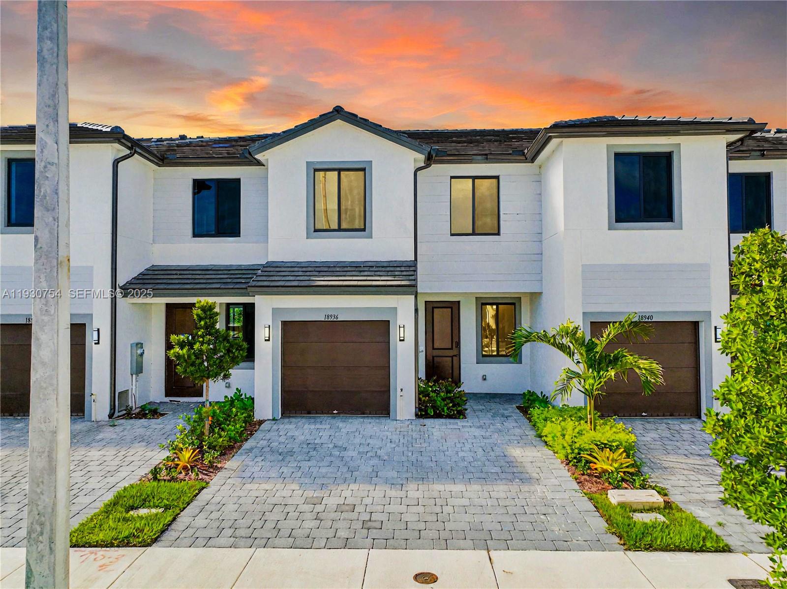 18936 Southwest 344th Terrace Homestead, FL 33034 - Photo 3 of 83 a front view of a house with a yard and garage