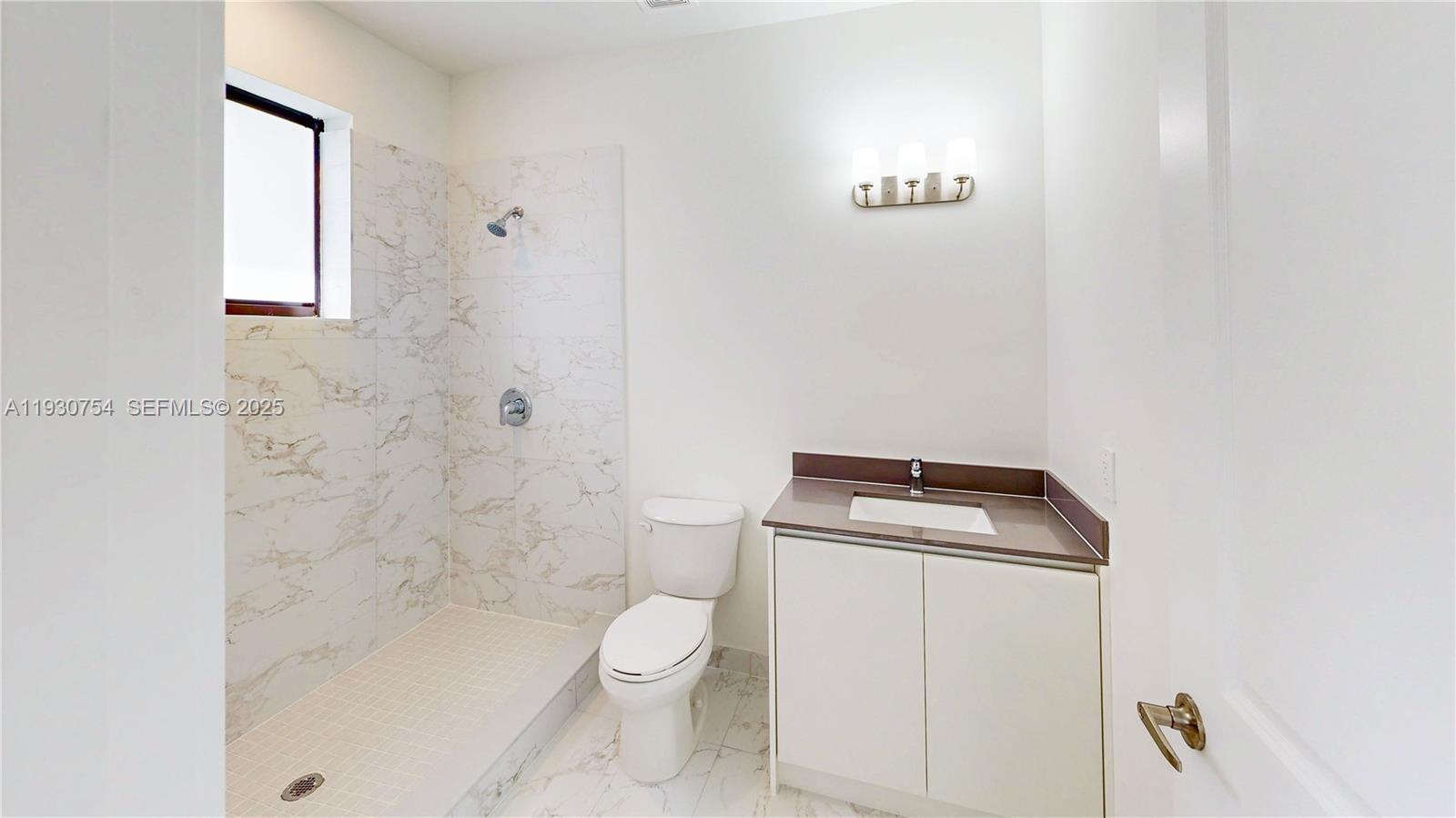 18936 Southwest 344th Terrace Homestead, FL 33034 - Photo 33 of 83 a bathroom with a toilet sink and shower