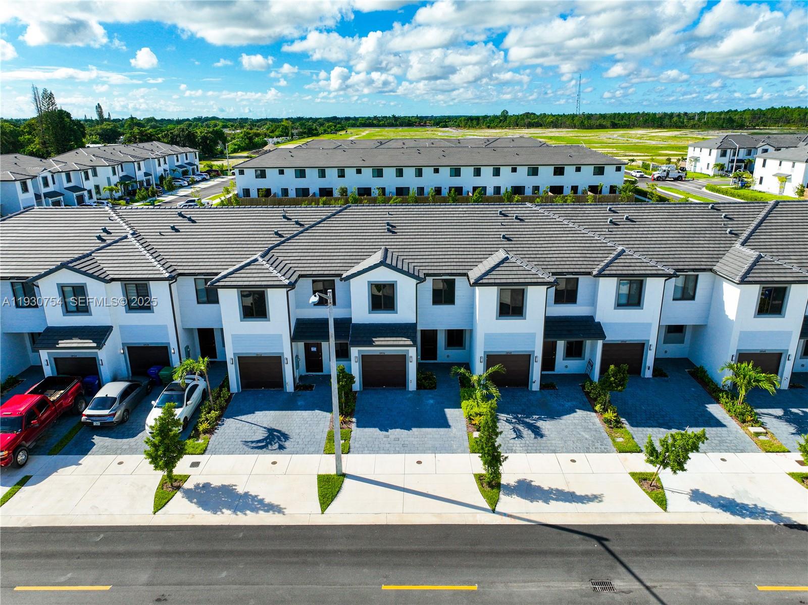 18936 Southwest 344th Terrace Homestead, FL 33034 - Photo 68 of 83 a aerial view of multiple houses with a big yard
